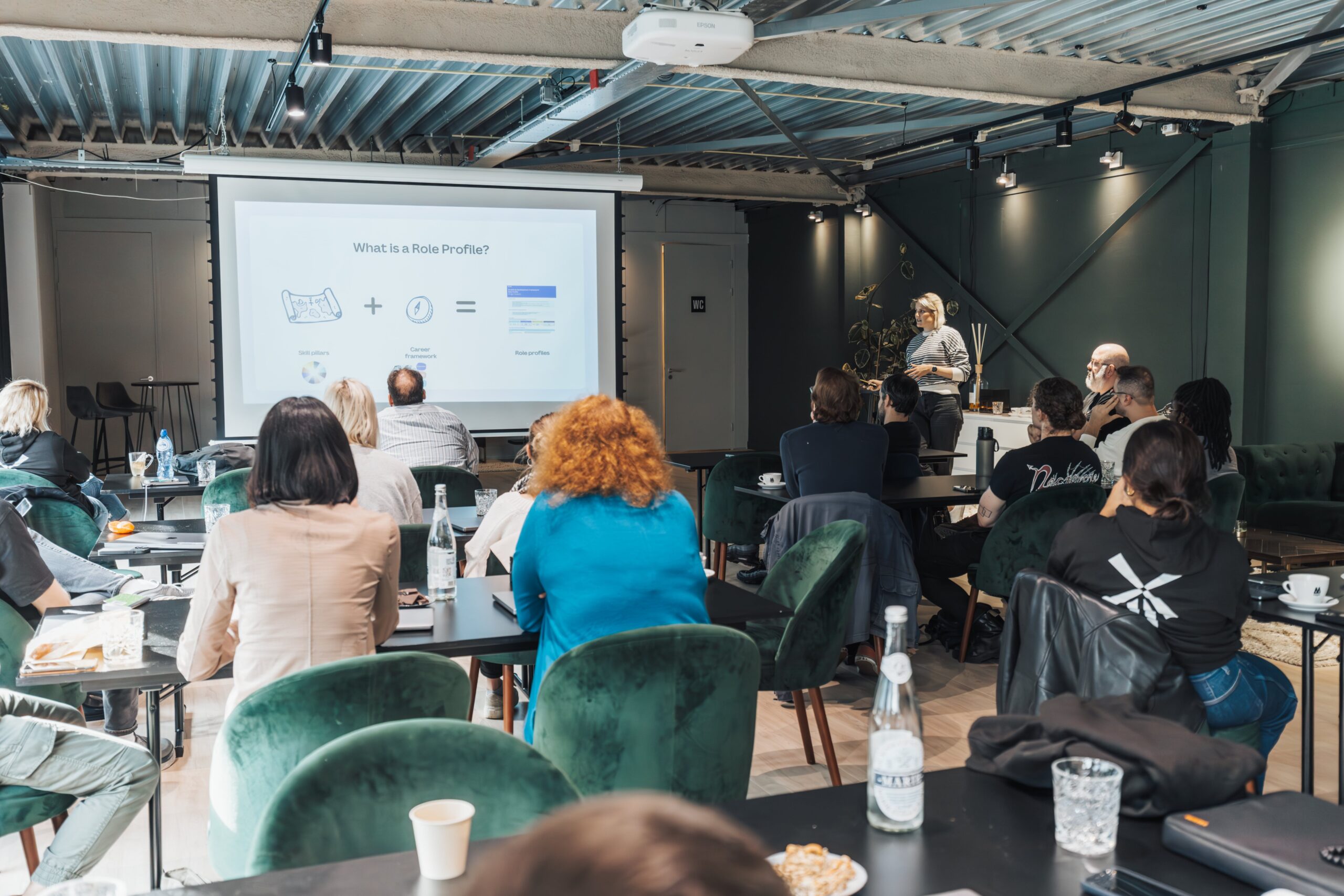 People in an office watching a presentation 